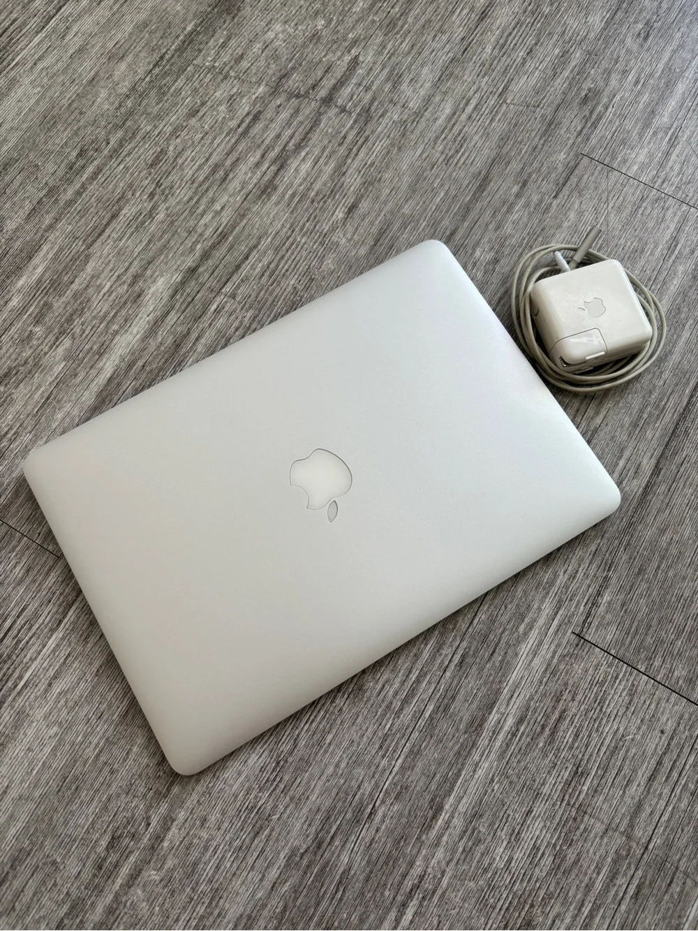 Apple Laptop in Silver with Charger Cord